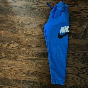 Nike youth blue medium sweatpants in good condition. Smoke free home.